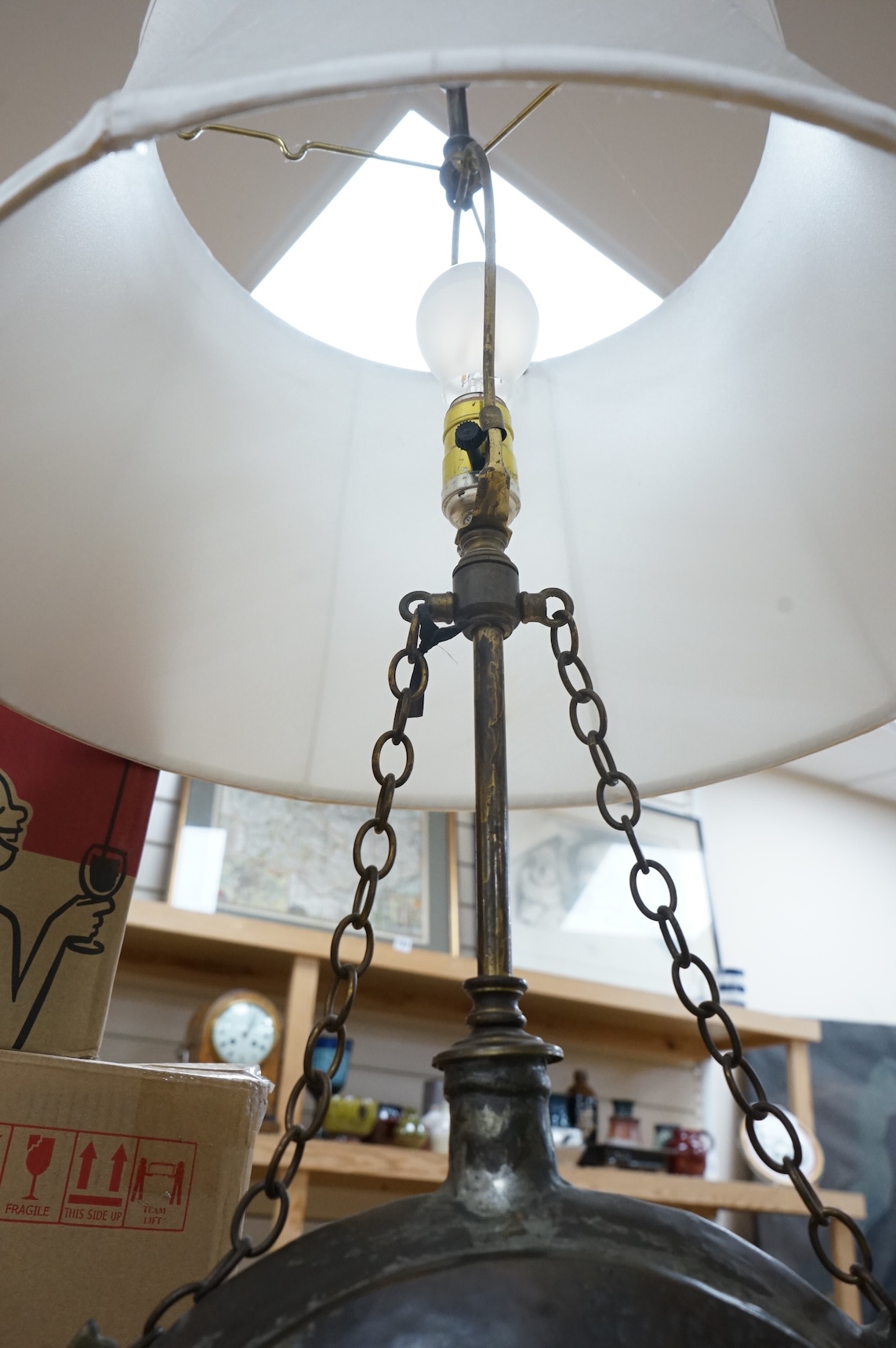 A Frederick Cooper Bouillotte lamp, together with a hammered metal table lamp, formed from a water flask (2)
